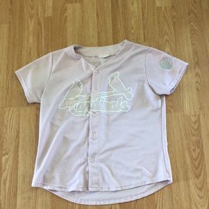 A pink cardinals shirt
